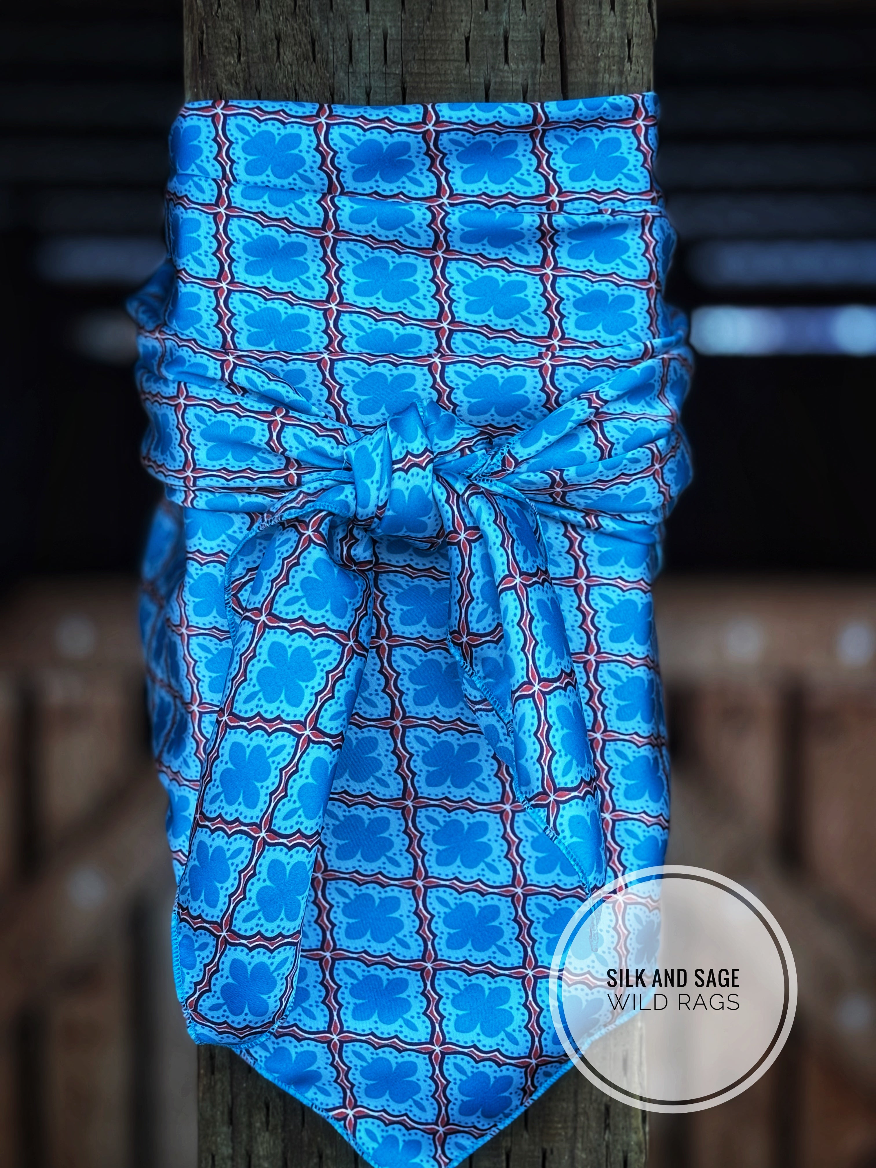Luxurious and spunky blue with bright orange charmeuse fabric print ...