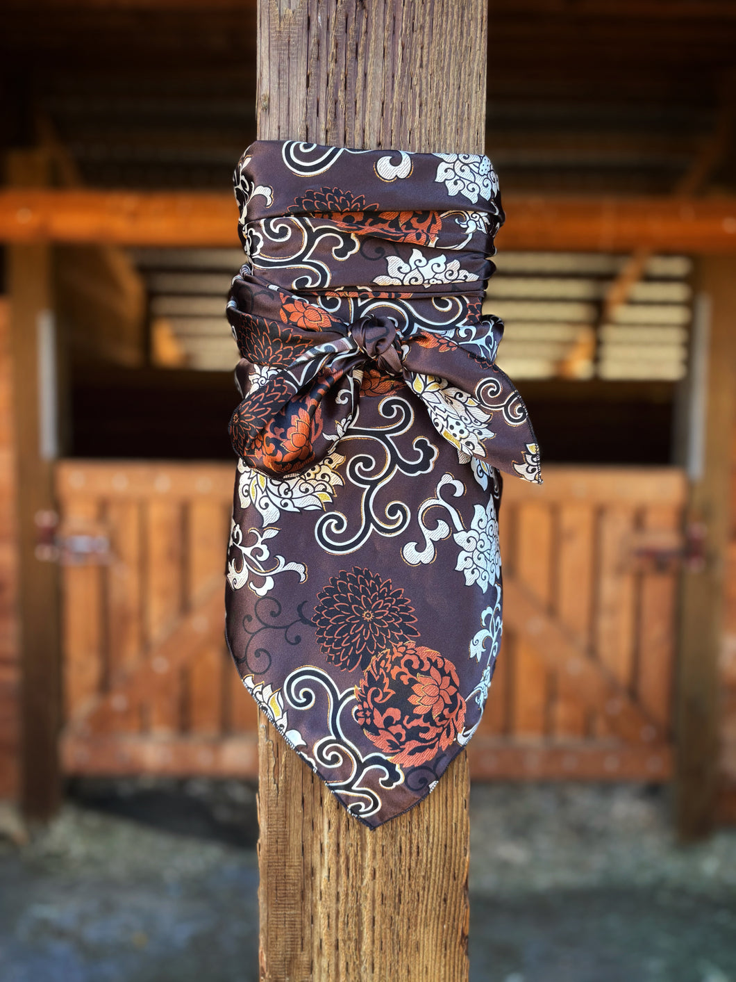 Deep brown back ground with rust and white flowers with a touch of gold on a silky charmeuse.