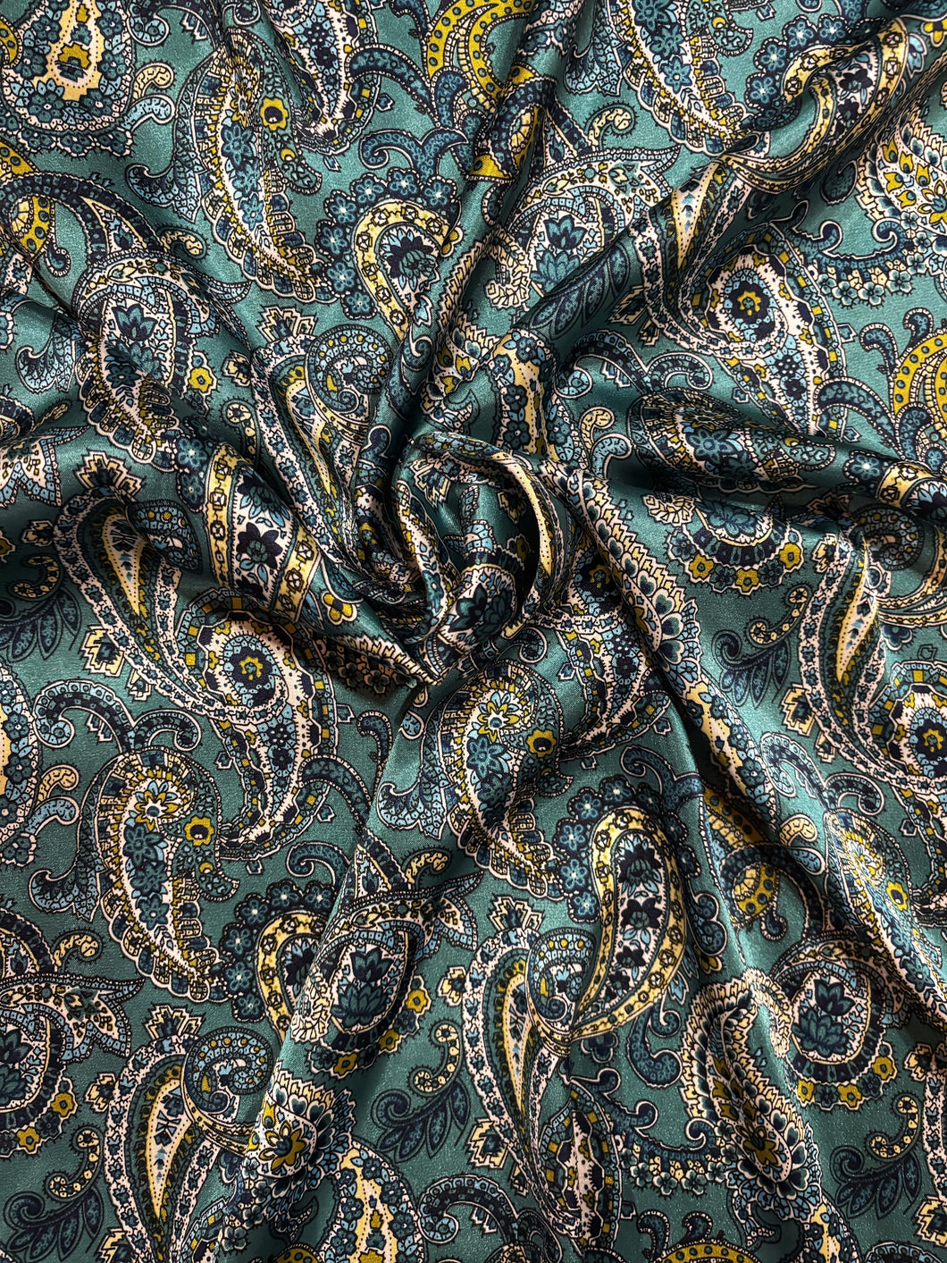 Teal, turquoise and green paisley on a Silky charmeuse fabric