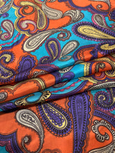 Load image into Gallery viewer, 100% lightweight silk. Fiery orange, deep purple, and turquoise paisley print.
