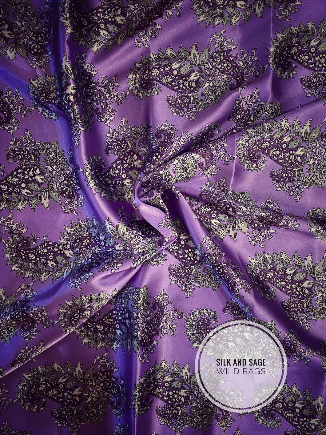 Beautiful purple tone paisley print on a silky charmeuse fabric.