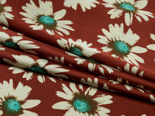 Load image into Gallery viewer, Deep rusty red, tan and turquoise super fun daisy floral silky charmeuse fabric.
