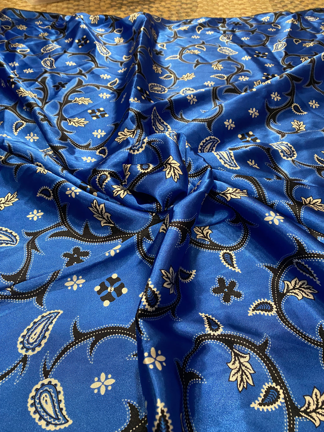 Boot top stitch, brilliant blue and white  floral and paisley print on a silky charmeuse fabric.