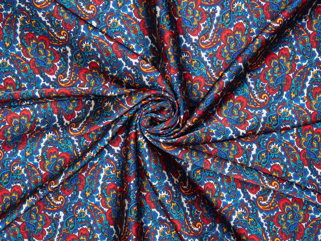 Fabulous blues, reds, mustard, teal and rust paisley and  floral print on a silky charmeuse fabric.