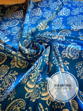 Load image into Gallery viewer, Bright blue and white tropical floral and paisley, silky charmeuse  print.
