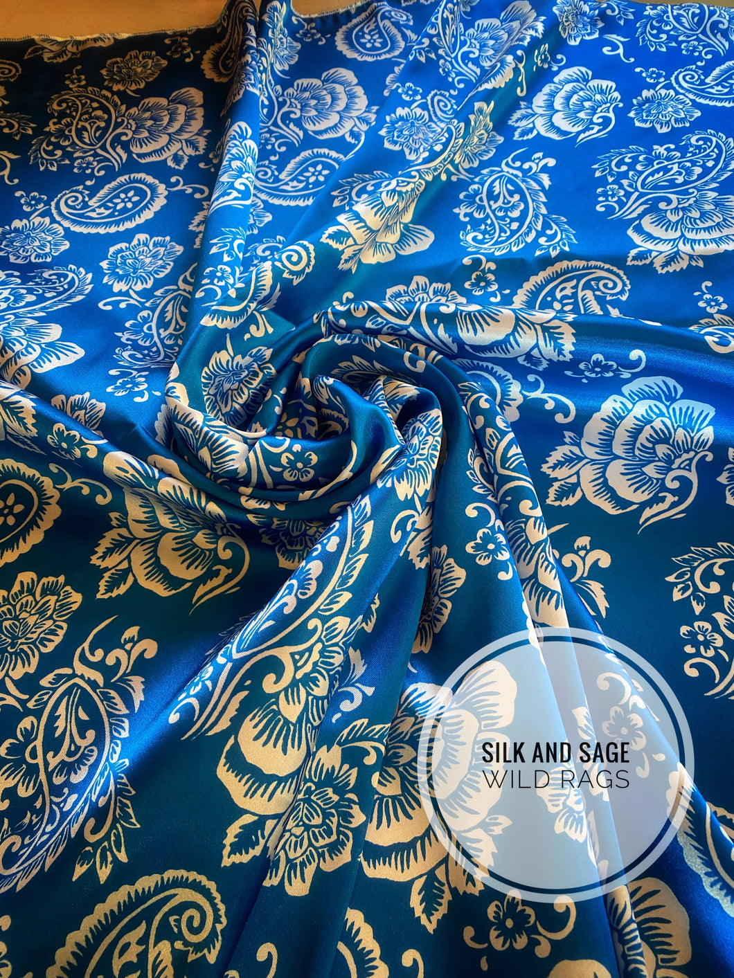 Bright blue and white tropical floral and paisley, silky charmeuse  print.