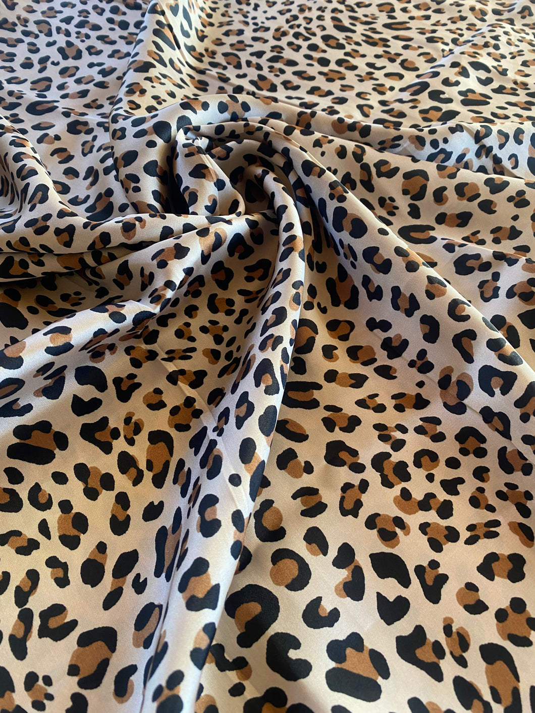 Classic cheetah print. Brown, black and gold tone silky charmeuse.