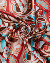 Load image into Gallery viewer, Super cool brown, tan, reds, blues and cream paisley and floral print on a silky charmeuse fabric.
