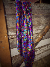 Load image into Gallery viewer, Colorful  purple, pink, green, blue, yellow and black paisley and floral print on a silky charmeuse fabric.
