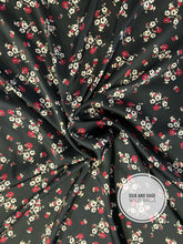 Load image into Gallery viewer, Elegant, black with tiny red and white flowers made of a thinner silky charmeuse blend fabric.
