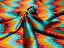 Load image into Gallery viewer, Bright, bold turquoise, mustard yellow, burgundy and orange Aztec, boho print on a silky charmeuse fabric.
