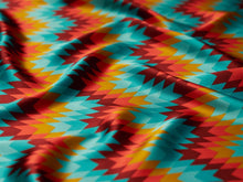 Load image into Gallery viewer, Bright, bold turquoise, mustard yellow, burgundy and orange Aztec, boho print on a silky charmeuse fabric.
