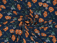 Load image into Gallery viewer, Rich navy background with bold burnt orange blooms. Made of soft peach skin fabric.
