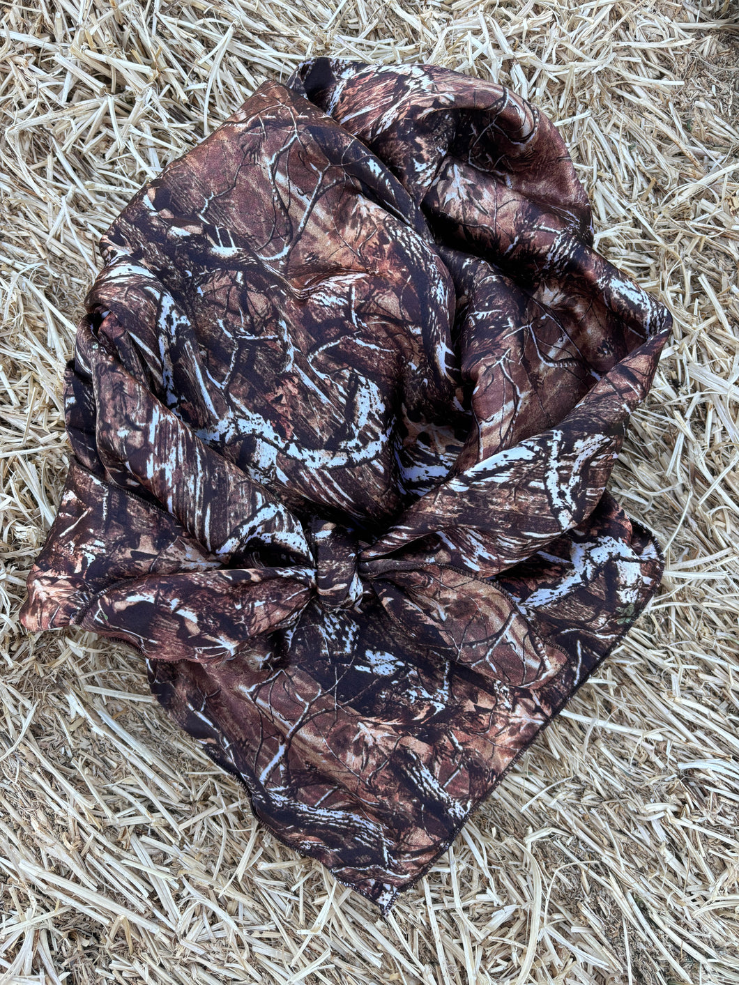 Bare timber style camo with brown tones, cream, and a hint of green. Soft charmeuse satin fabric.