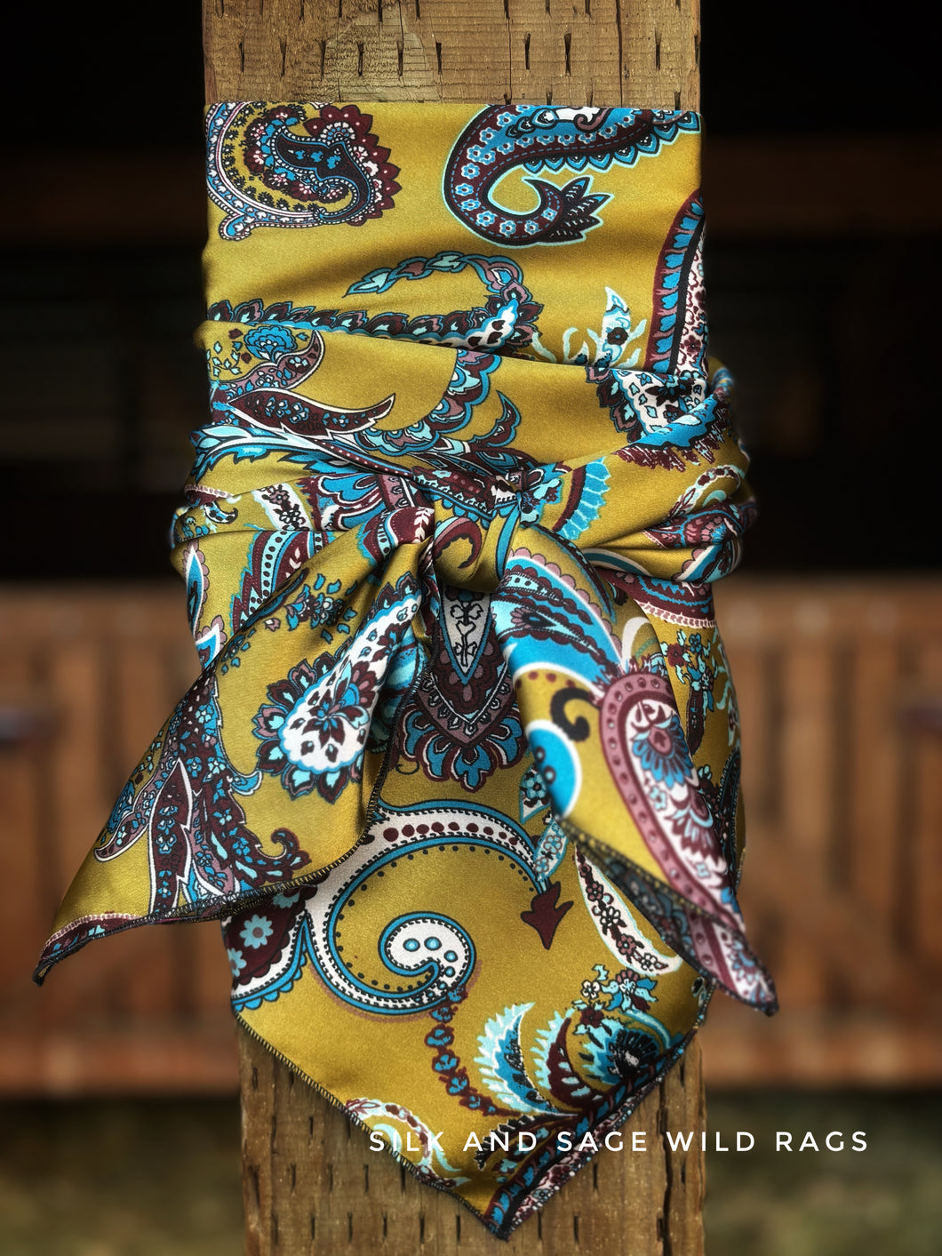 Rich stunning mustard, teal, burgandy and cream paisley print on a silky soft charmeuse fabric.