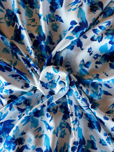 Load image into Gallery viewer, Bright blue floral with a white back ground on a silky satin charmeuse fabric
