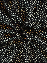 Load image into Gallery viewer, black and white polka dot soft peach skin fabric
