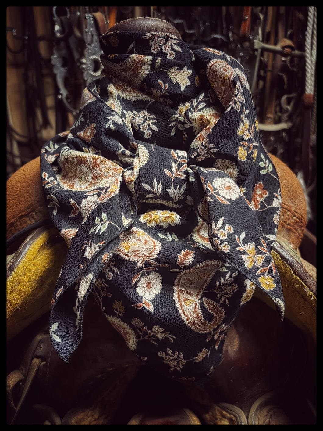 Stunning black, rust and cream paisley and floral print on a soft peach skin fabric.