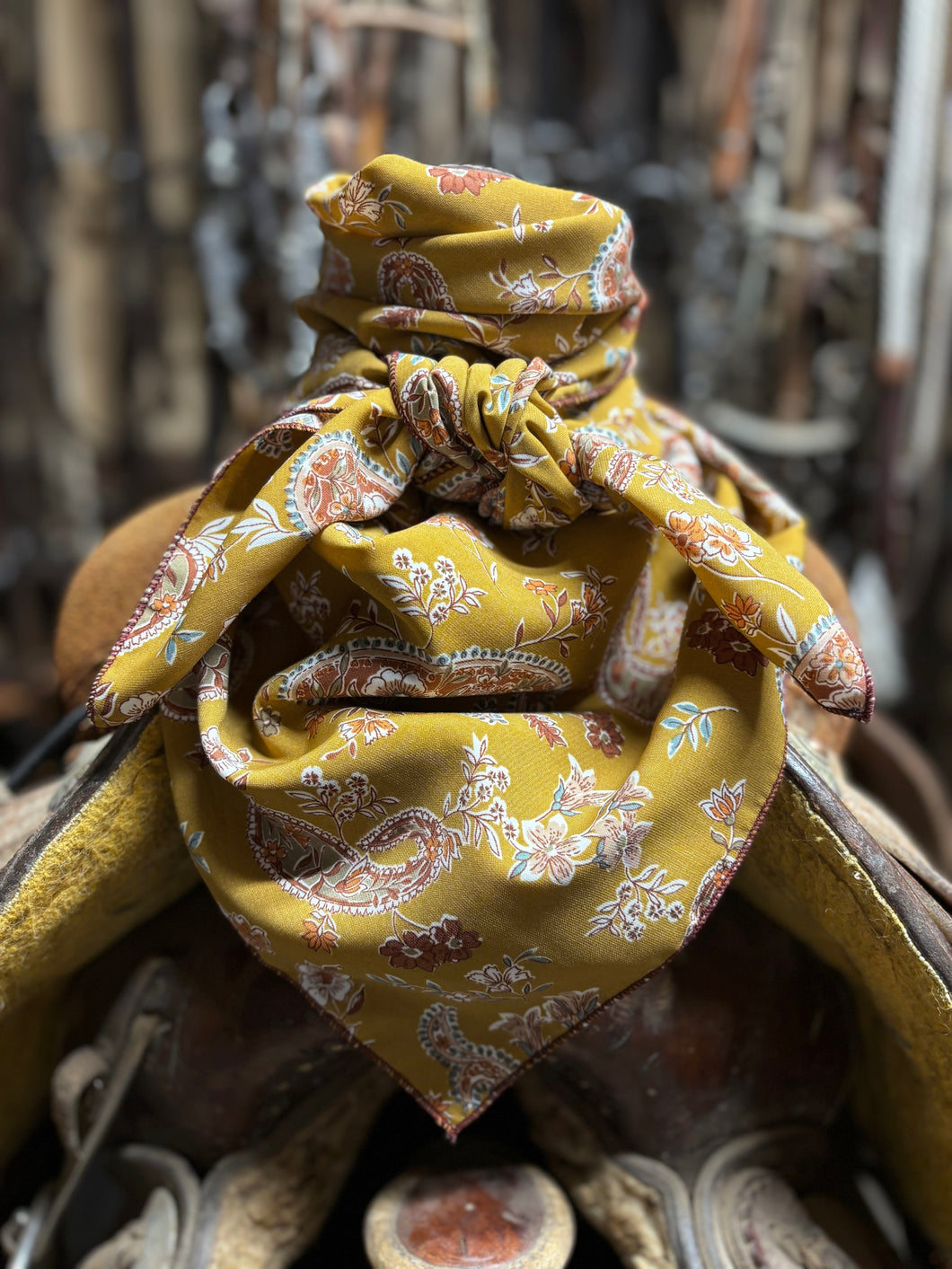 Stunning mustard, rust paisley and floral print on a soft peach skin fabric