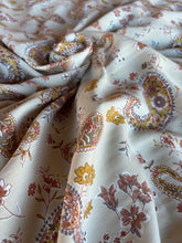 Load image into Gallery viewer, Stunning cream, buttery golden mustard yellow with hints of sage green, paisley and floral print on a soft peach skin fabr
