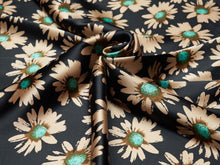 Load image into Gallery viewer, Deep black, tan and turquoise super fun daisy floral silky charmeuse fabric.
