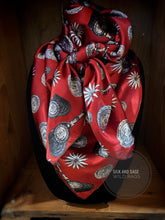 Load image into Gallery viewer, Elegant spur and concho print. Ruby red,  silver and  black silky charmeuse fabric
