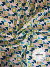 Load image into Gallery viewer, Boho, tribal, Aztec print. Light blue, teal, turquoise, lime green and white tone silky cdc fabric.

