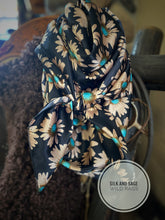 Load image into Gallery viewer, Deep black, tan and turquoise super fun daisy floral silky charmeuse fabric.
