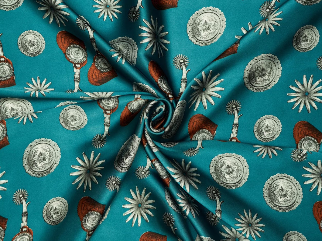 Elegant spur and concho print. Teal, turquoise silver and  black silky charmeuse fabric