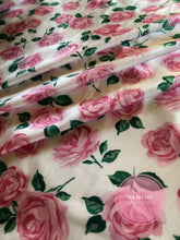 Load image into Gallery viewer, Beautiful soft pink roses with green leaves and white back ground floral silky charmeuse fabric
