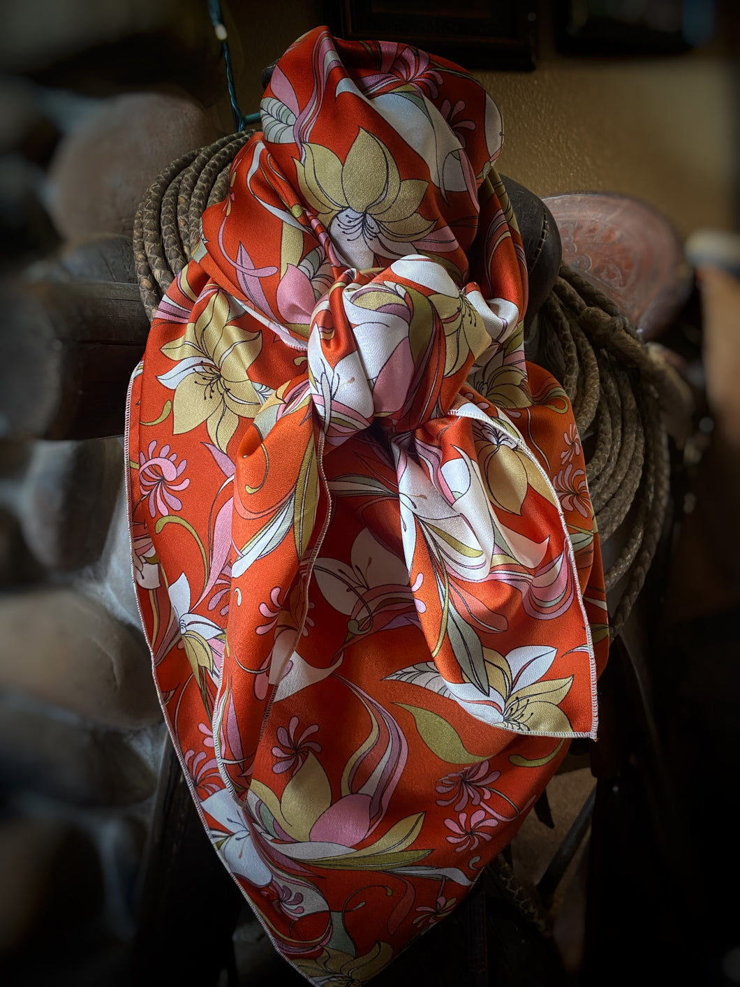 Large, orange, tan, pink and white floral print. Made of soft, satin fabric.