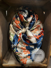 Load image into Gallery viewer, Bright corral, cream, blue, and tan floral silky charmeuse fabric
