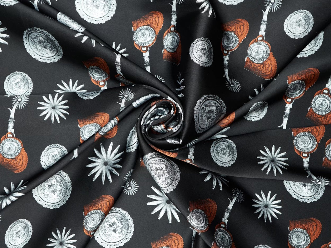 Elegant spur and concho print. Deep black, silver and  silky charmeuse fabric