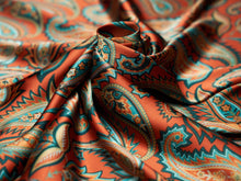 Load image into Gallery viewer, Stunning jagged paisley and floral print. Vibrant orange, sky blue, teal, turquoise and tan silky charmeuse.
