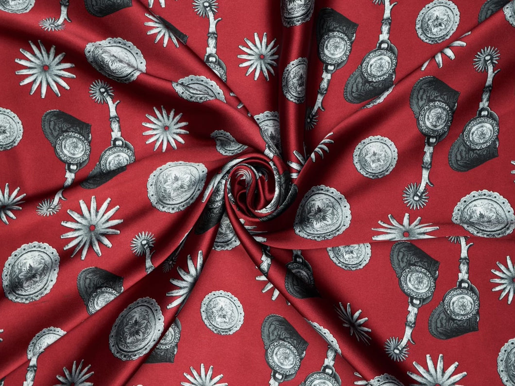 Elegant spur and concho print. Ruby red,  silver and  black silky charmeuse fabric